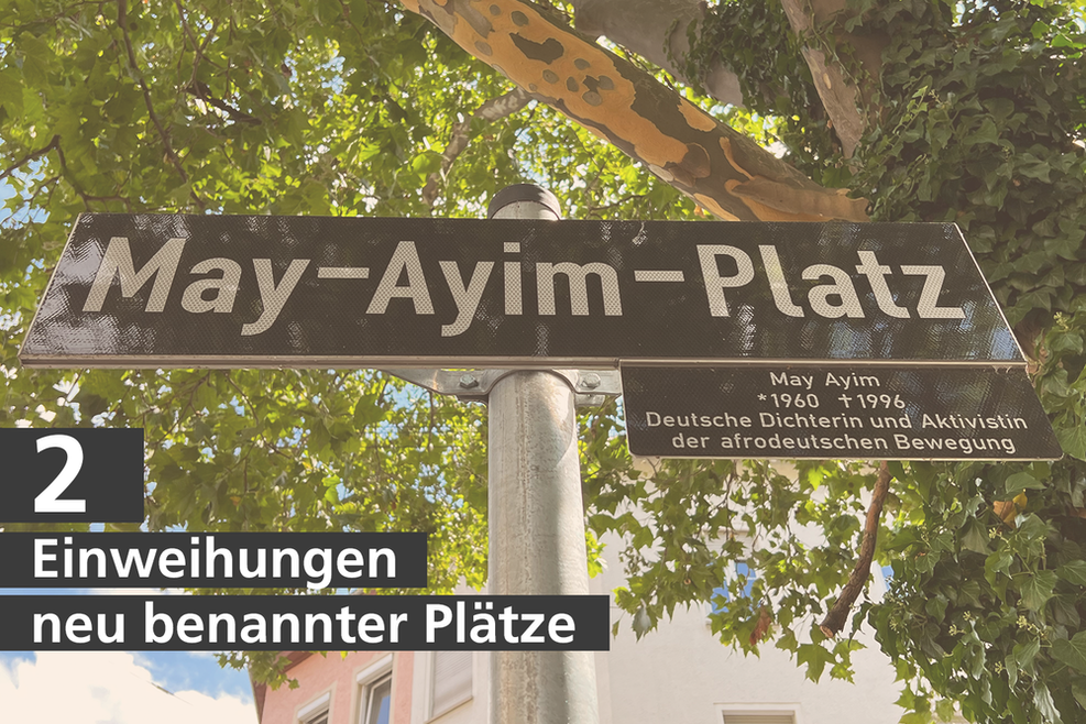 Das Straßenschild zum May-Ayim-Platz. Schriftzug: "2 Einweihungen neu benannter Plätze"